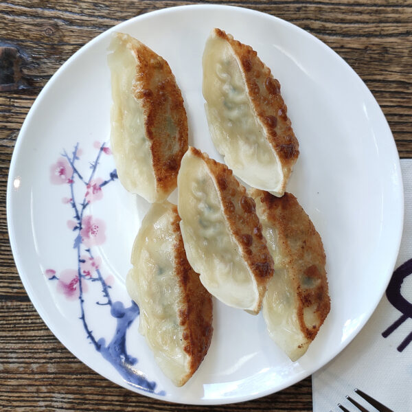 Pan-fried chicken and  vegetable dumplings